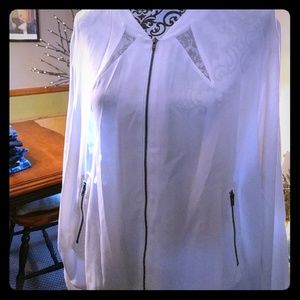 Cream colored sports meets couture zip up jacket.